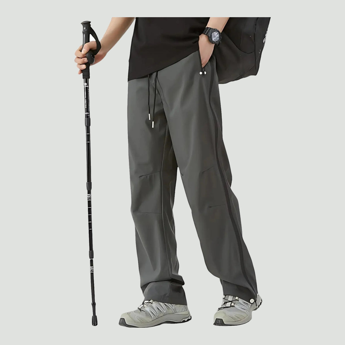 Unisex rain pants in Grey, worn with hiking shoes