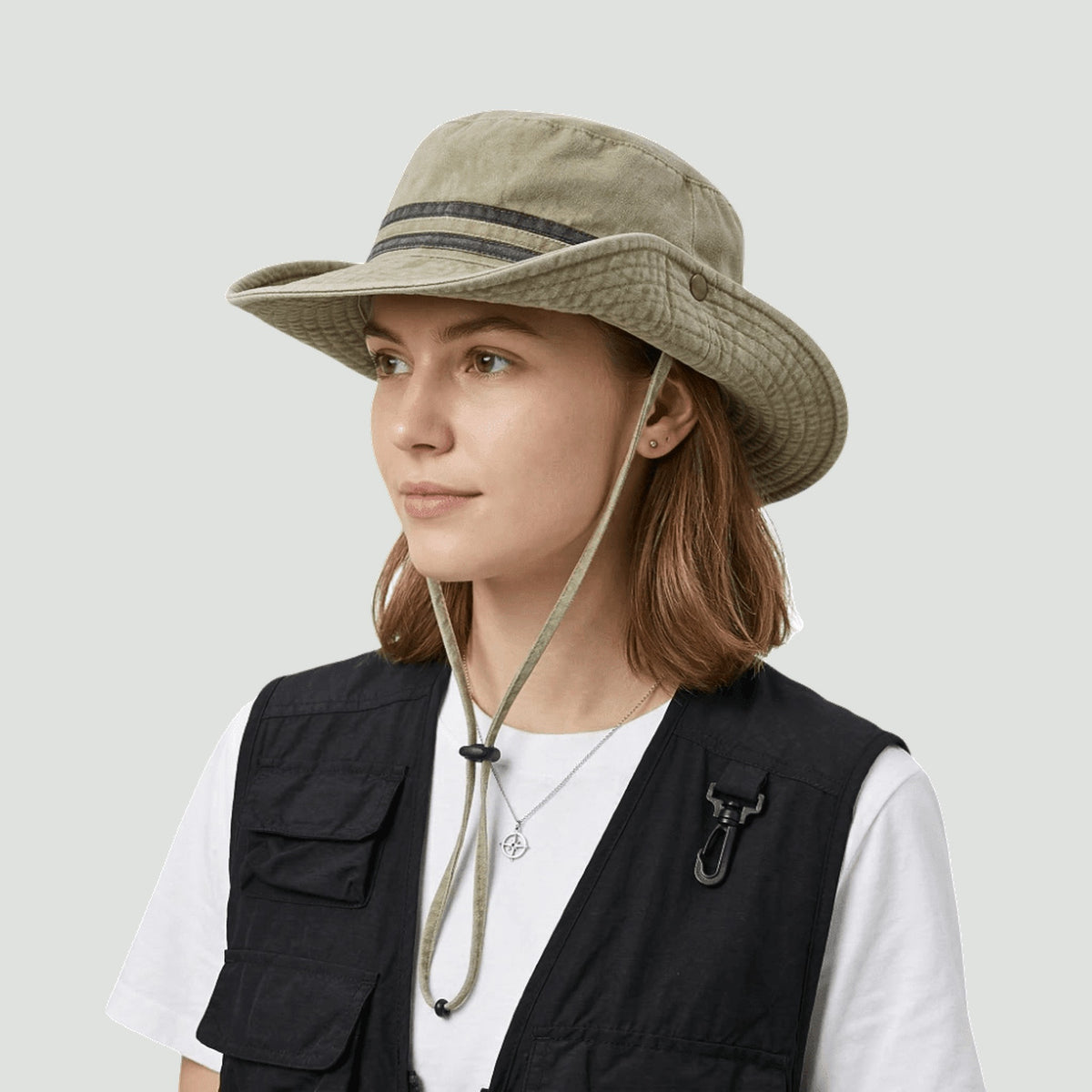 Woman wearing the packable safari hat in Khaki with the chin strap