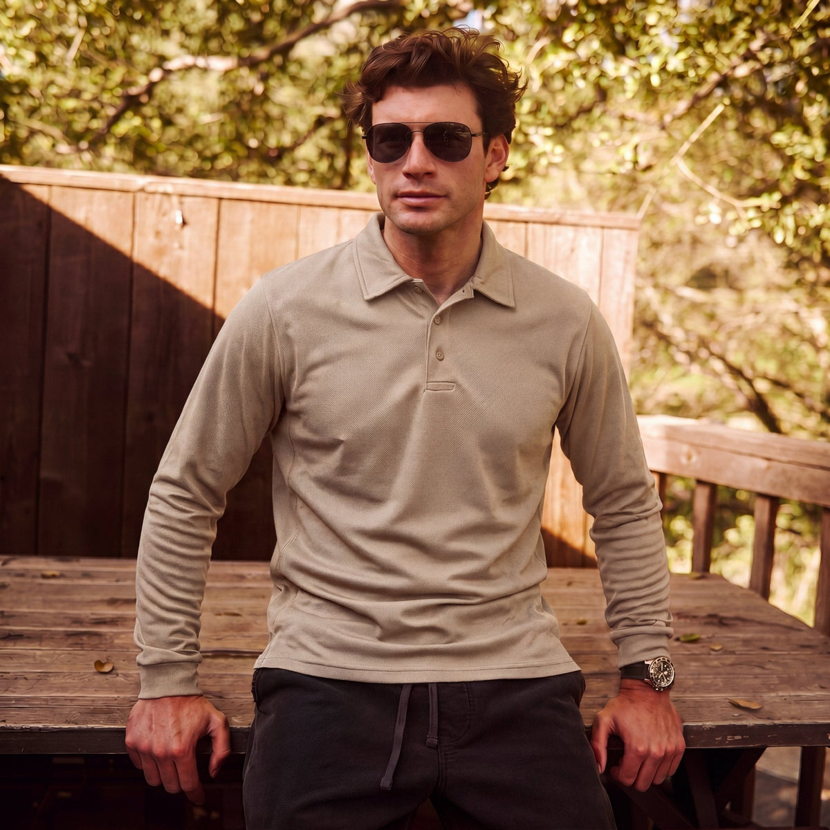 Man wearing the men's long sleeve polo in Khaki
