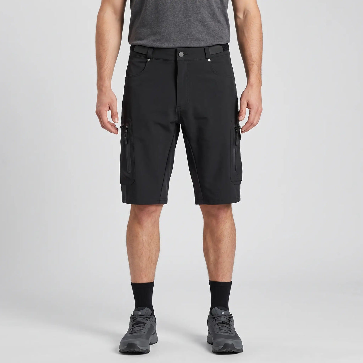 Black MTB shorts worn, front view with zipped thigh pockets