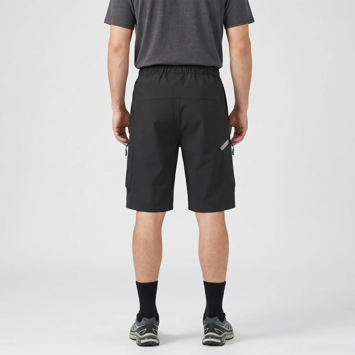 Black MTB shorts worn, back view with elastic waistband