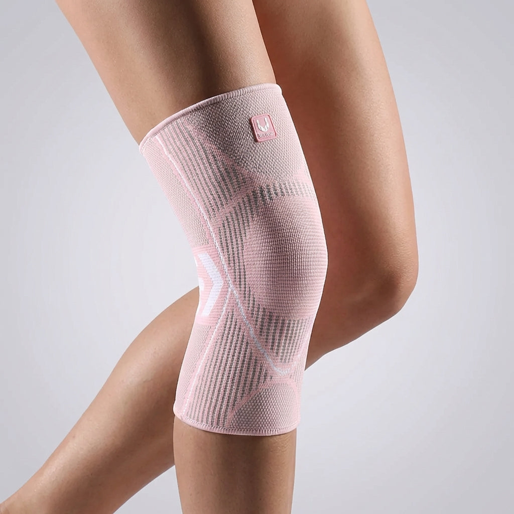 Knit compression knee sleeve in Pink, worn on the knee