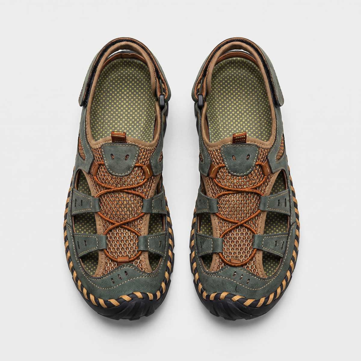 Men's closed-toe leather and mesh sandals in olive green, top-down pair
