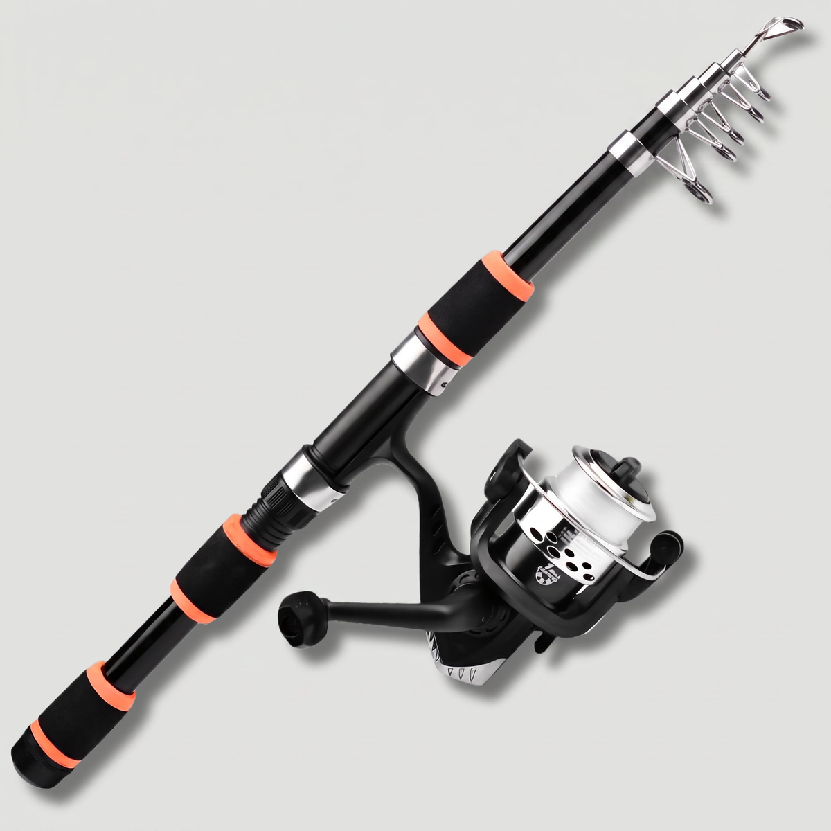 Telescopic fishing rod and reel combo in black, extended