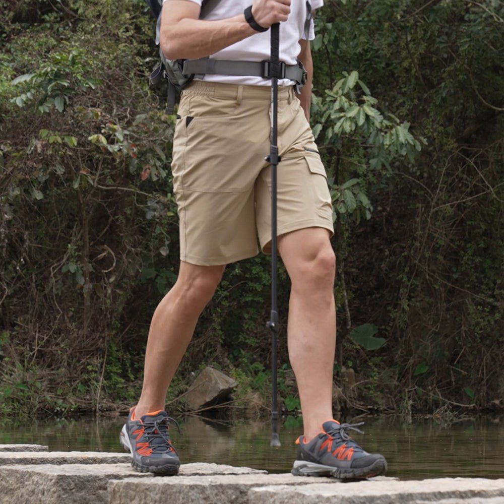 Man wearing the men's stretch cargo shorts in Khaki on a hike