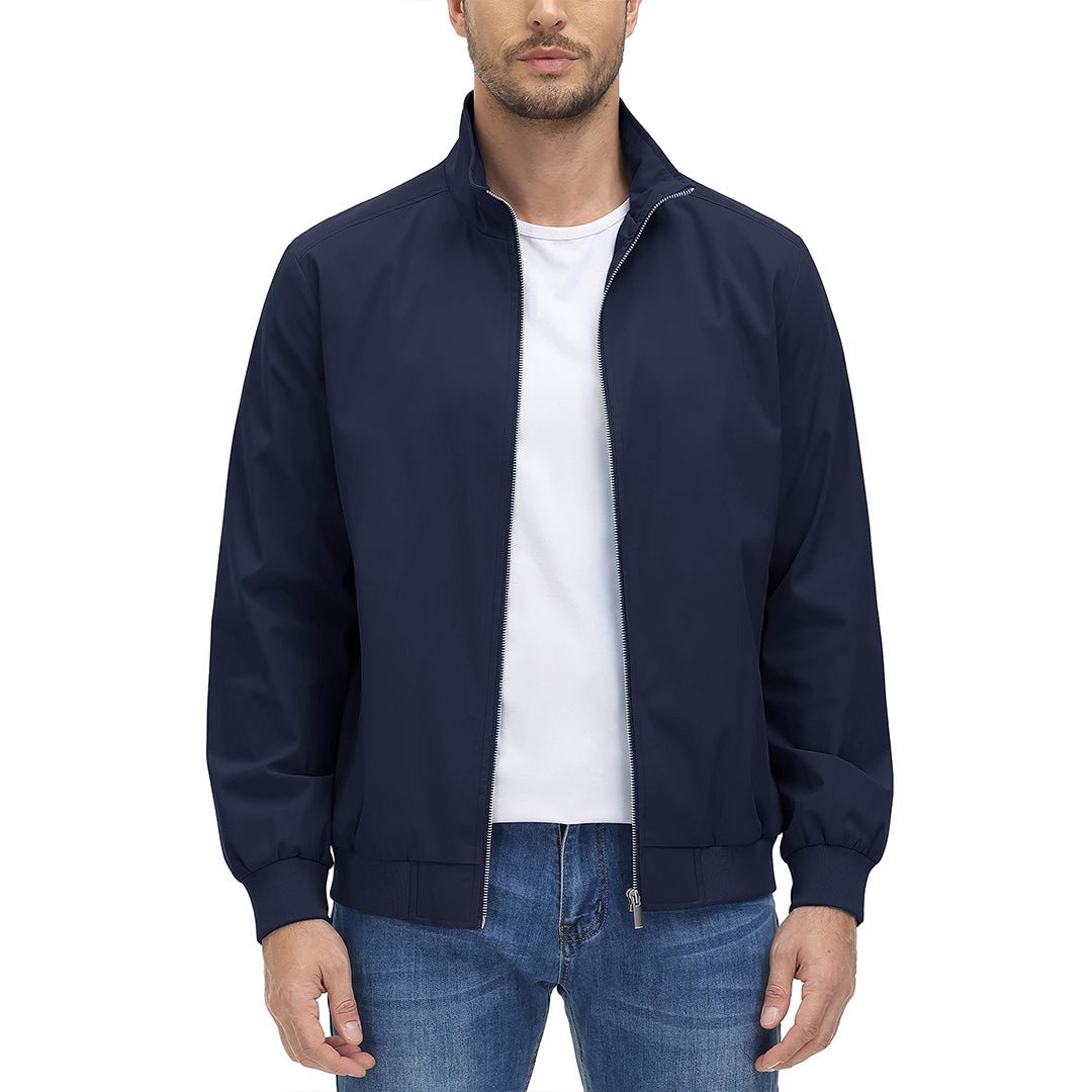 Man wearing the Navy men's windbreaker jacket with a white tee