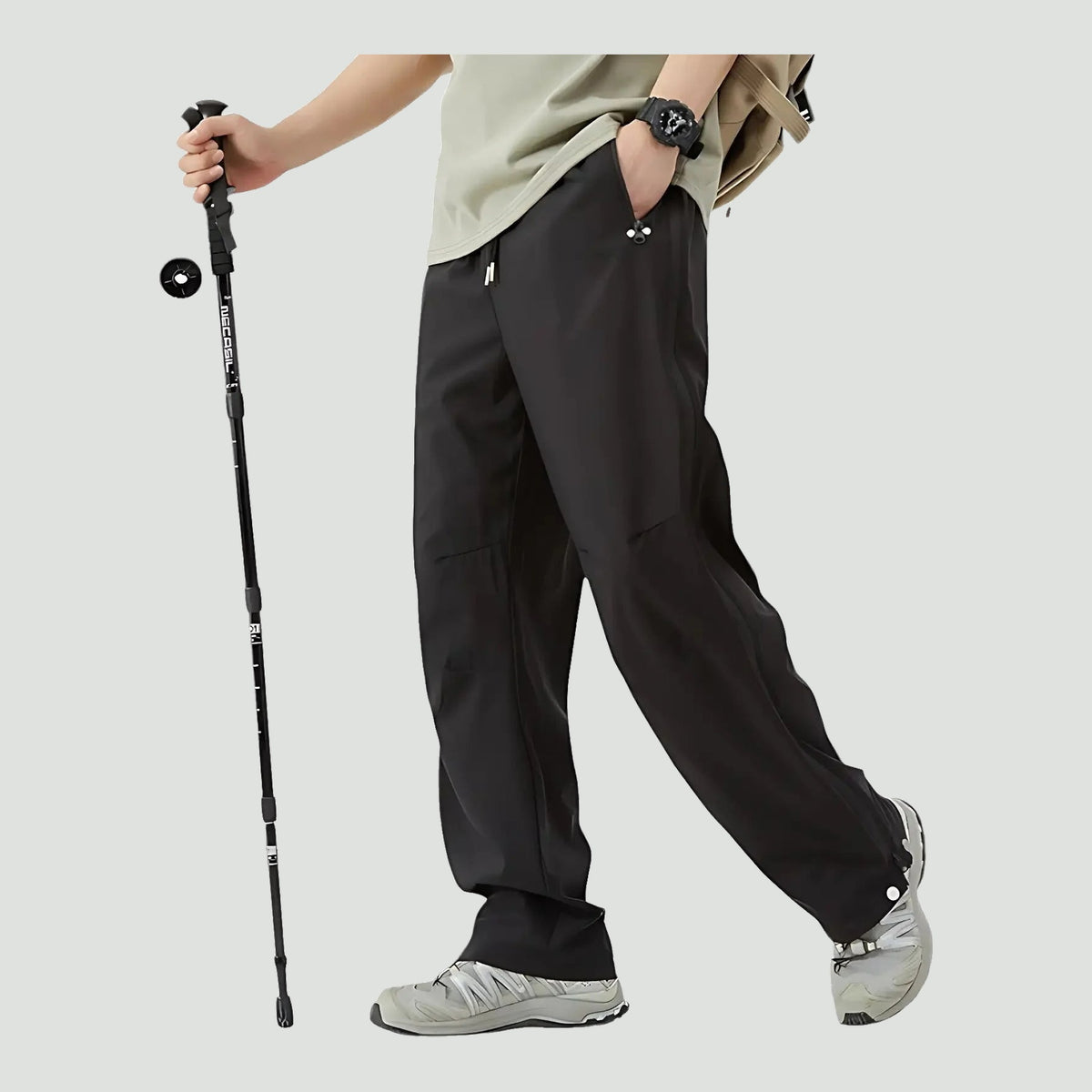 Unisex rain pants in Black, worn with hiking shoes