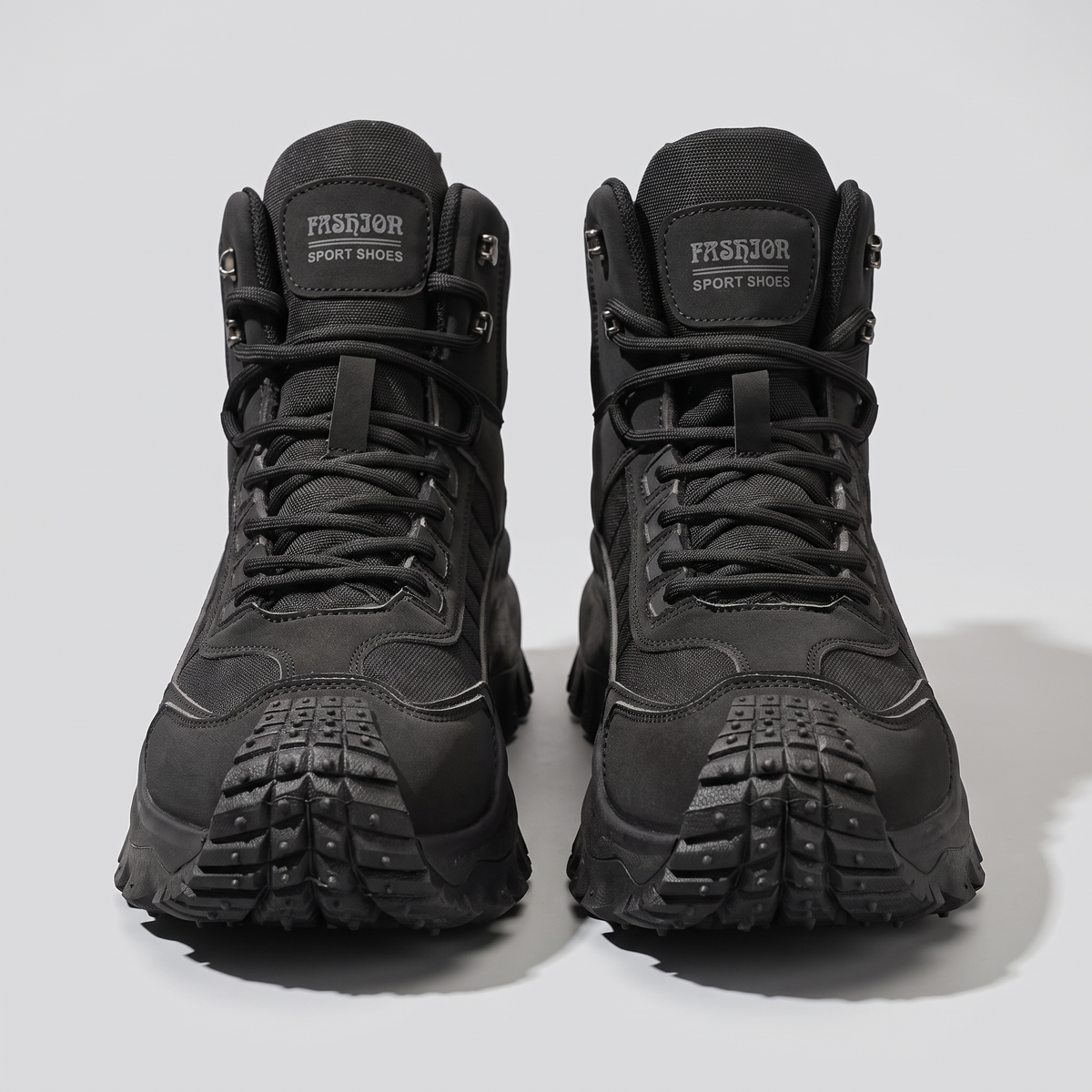 Men's hiking boots - Black - front view with tongue patch and studded toe