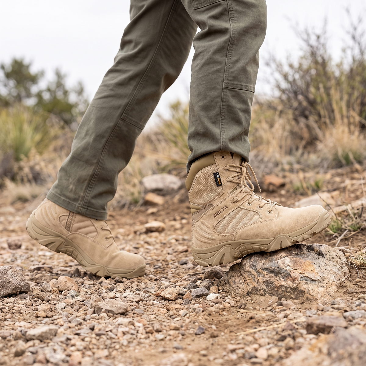 Khaki tactical hiking boots on a rocky gravel trail